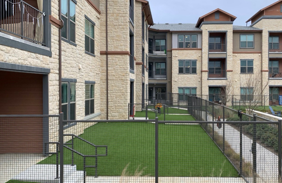 Synthetic grass lawn in the courtyard