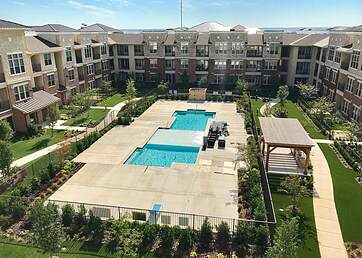 Apartment complex with artificial grass lawns