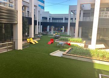 Artificial grass lawns installed in a shared courtyard