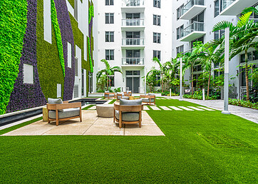 Shared community area with artificial grass lawn