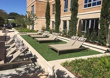 Artificial turf installed around the community swimming pool area