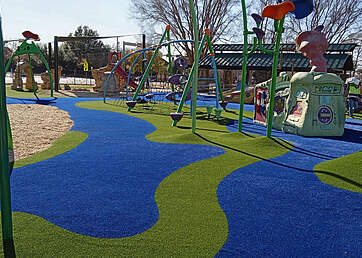 Blue and green turf at park playground