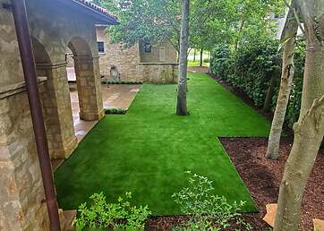 Home side yard installed with artificial turf