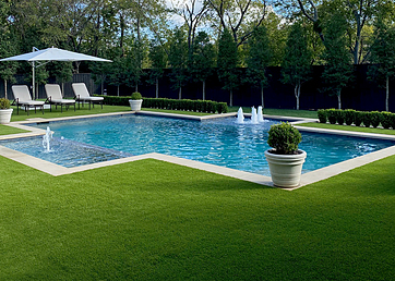 Artificial grass lawn surrounding a swimming pool